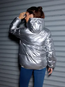 Back view detail of a shiny silver hooded puffer jacket for winter fashion