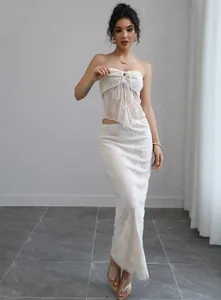 Elegant white lace tube top and long skirt two-piece set perfect for a beach vacation