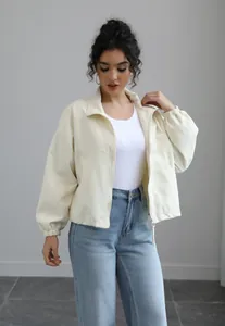 Elegant cream waterproof short windbreaker jacket with stand collar and zipper for women