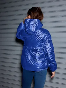 Back view of a glossy electric blue hooded puffer jacket for trendy winter outdoor wear