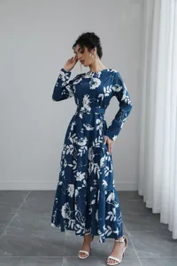 Elegant French-style blue floral long-sleeve maxi dress with waist tie and tiered hem