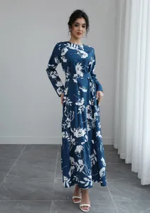Full view of a blue long-sleeved floral maxi dress with French style waist tie