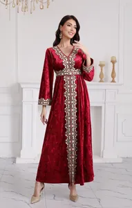 Elegant wine-red velvet maxi dress with ethnic embroidery and V-neckline details.