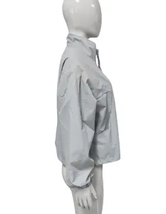 Side view profile of a light grey women's short windbreaker jacket with a stand collar