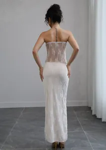 Back view of an elegant white floral lace tube top and matching long skirt set for resort style.