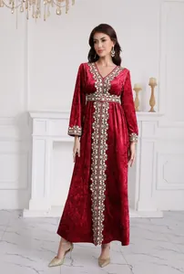 Elegant deep red velvet maxi dress with intricate gold embroidery and V-neck detail