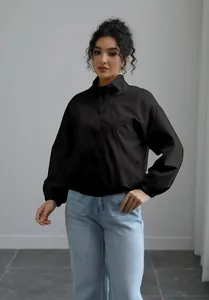 Detailed view of women's black waterproof windbreaker jacket with a chic stand-up collar
