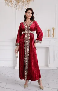 Elegant red velvet long dress with intricate ethnic embroidery on neckline and waist