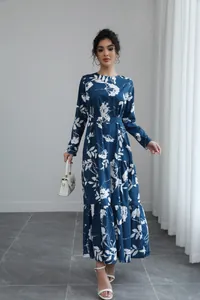 French style blue long-sleeve midi dress with white floral print and tie waist on model