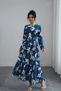 Full length view of a blue long-sleeve maxi dress with elegant white floral print patterns