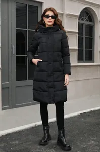 Full-body view of a long black hooded winter puffer coat with a slim fit design
