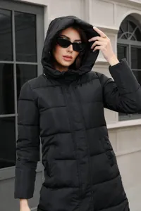 Professional detail view of a black hooded puffer jacket with thick quilted design