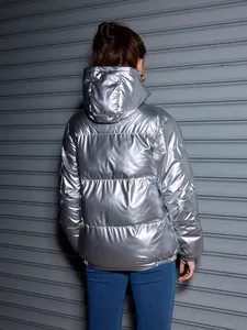 Oversized shiny silver metallic hooded puffer jacket for unisex winter streetwear style