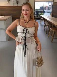 Sweet summer white two-piece set with black bow camisole and pleated fairy skirt