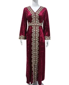Full view detail of an elegant V-neck embroidered velvet maxi dress in burgundy red