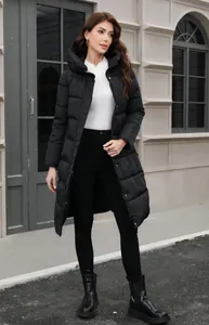 Full view of women's long black hooded puffer jacket with slim fit for winter