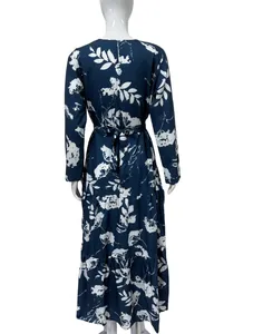 Back view of navy blue floral long-sleeved midi dress showing detailed waist-tie