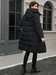 Stylish women's long black hooded puffer coat with quilted thick insulation for winter