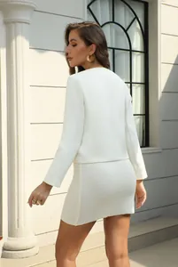 Back view of an elegant white tweed jacket and matching dress two-piece set