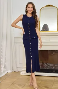 Full length view of a navy sleeveless ribbed knit dress with gold button details and a slit.
