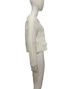 Elegant French style white tweed jacket side profile view on white mannequin detail shot