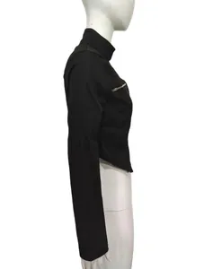 Side detail view of a black stand-collar jacket with asymmetrical hem and metal zipper