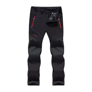Pantalones softshell impermeables para exteriores con forro polar y detalles rojos