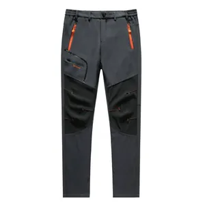 Pantalones de senderismo softshell impermeables gris oscuro con cremalleras naranja