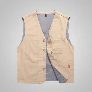 Close-up of khaki multi-pocket men's vest with striped lining and canvas texture