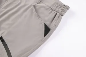 Close-up detail of cargo shorts showing pocket design and durable tech fabric texture