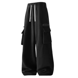Detail of men's black polar fleece cargo sweatpants with wide leg and drawstrings