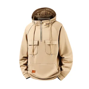 Close-up detail of men's retro khaki hoodie featuring half-zip and multi-pocket design