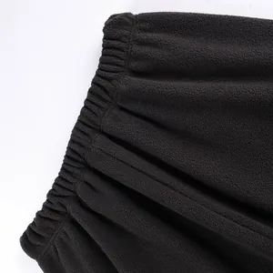 Close-up of elastic waistband on thick black polar fleece sweatpants