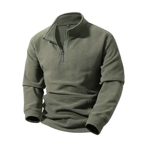 Detailed macro view of men's olive green half-zip fleece pullover with soft texture