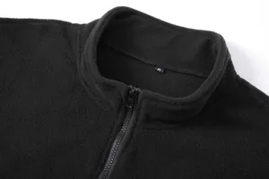 Close-up detail showing the collar and zipper of a black men's half-zip fleece pullover