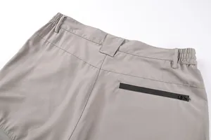 Detailed view of grey men's tactical cargo shorts with a waterproof rear zipper pocket