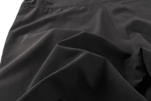 Macro detail of breathable ripstop fabric on men's outdoor sports shorts