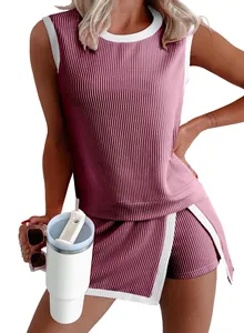 Close-up showing the ribbed fabric texture and white trim of pink sleeveless top