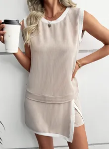 Detailed view of beige ribbed sleeveless top and shorts set with white trim