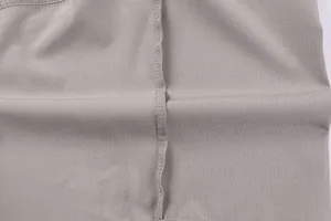 Detailed close-up of high-quality inner stitching and durable fabric on grey cargo shorts.