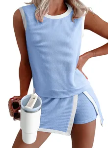 Close-up of blue ribbed knit summer set for women featuring white trim accents