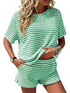Close-up of green and white striped two-piece shorts set texture and fit