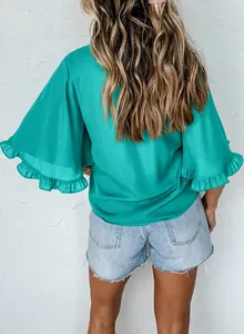Stylish teal summer blouse featuring elegant ruffled short sleeves seen from the back view