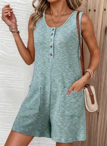 Close-up detail of waffle-knit sleeveless romper featuring button-front and pockets