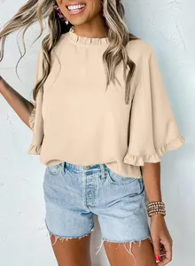 Close-up of summer round neck blouse with elegant ruffle sleeves and flounce details