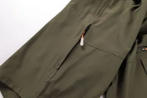 Close-up of zipper pocket and durable fabric texture on army green outdoor shorts