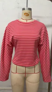 Close-up detail of a women's pink and red striped long sleeve batwing T-shirt
