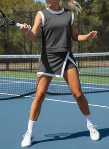 Women's stylish ribbed athletic tennis set shown in action on a sunny outdoor court