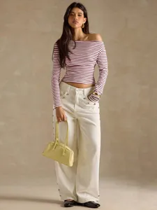 Chic striped off-shoulder long sleeve T-shirt for women in trendy casual autumn style.