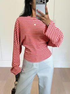 Stylish red and pink horizontal striped batwing sleeve T-shirt shown in a mirror selfie detail